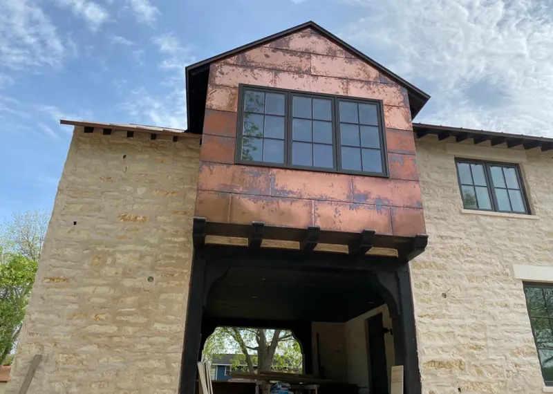 Copper metal panel facade on a stone building for Metal Roof Coating in Dallas