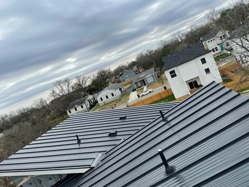 Standing seam metal roof panels with vents for Skylight Repair in Dallas